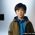 유승호 아역 시절 활동 - A young Korean boy actor around 8 years old, wearing modest, neat casual clothing and a light jacket...